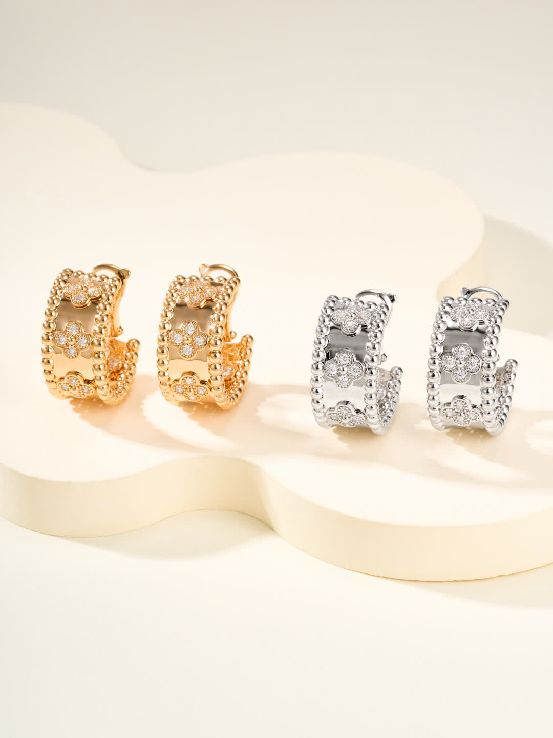 Van Cleef & Arpels Elegant Gold and Silver Hoop Earrings with Diamond Accents Van Cleef & Arpels Elegant Gold and Silver Hoop Earrings with Diamond Accents